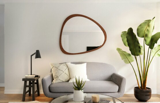 a living room filled with furniture and a mirror